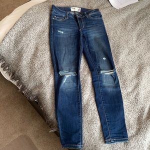 ripped blue skinny jeans